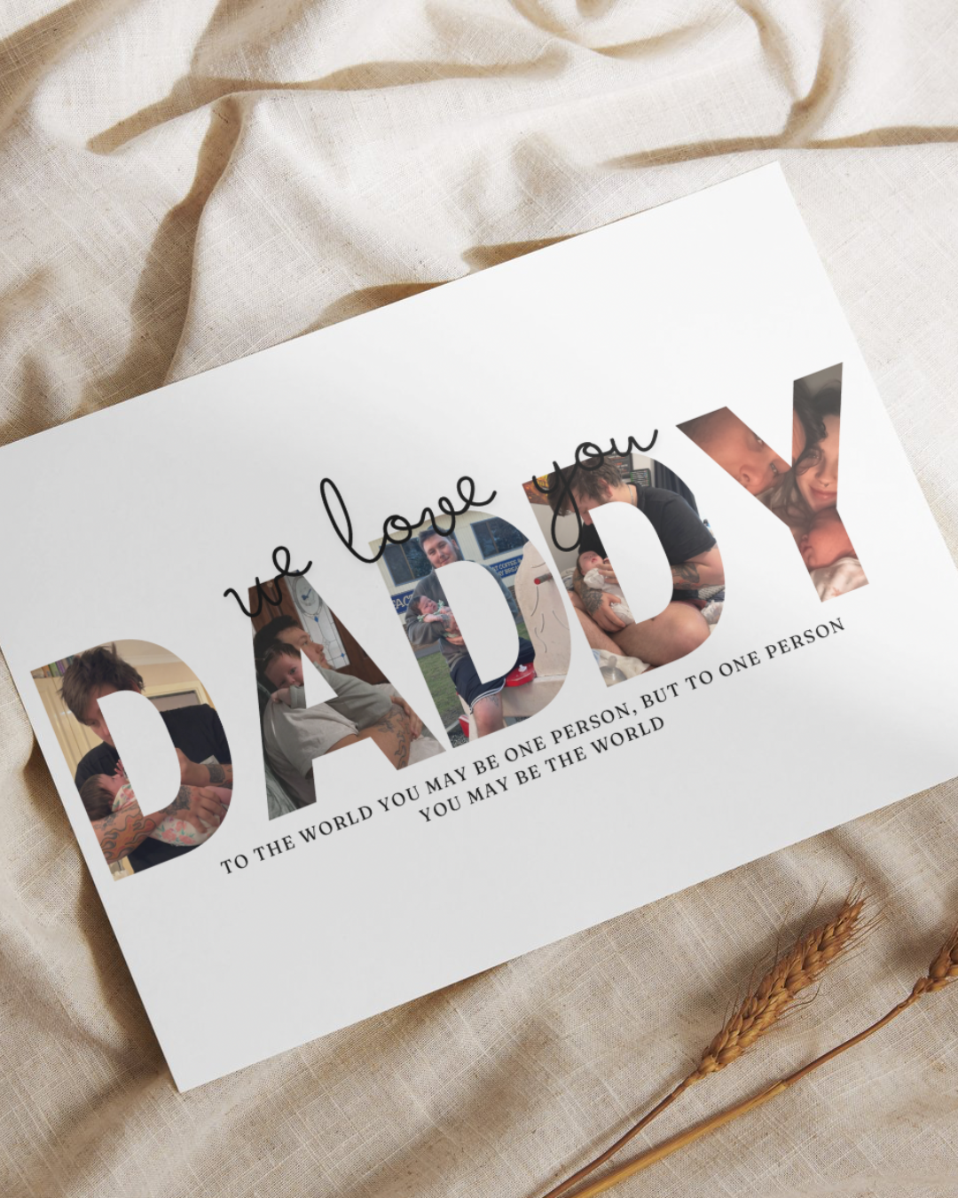 A photo print with the word 'Daddy' in a stylized font, accompanied by a photo of a man and a baby, likely to be customized with additional photos and text.